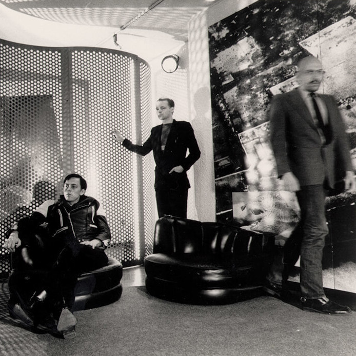 <p>General Idea relaxes in the installation <em>Reconstructing Futures</em>, 1977, installation, mixed media, overall 274 x 432 x 1,017 cm, National Gallery of Canada, Ottawa, photograph by Jeremiah S. Chechik. <em>From left</em>: Felix Partz, AA Bronson, and Jorge Zontal.</p>
<p> </p>
<p>Banner: General Idea, <em>Artist’s Conception: Miss General Idea 1971</em>, 1971, screen print on salmon wove paper, 101.5 x 66 cm, edition of nine, signed and numbered, various collections. </p>
