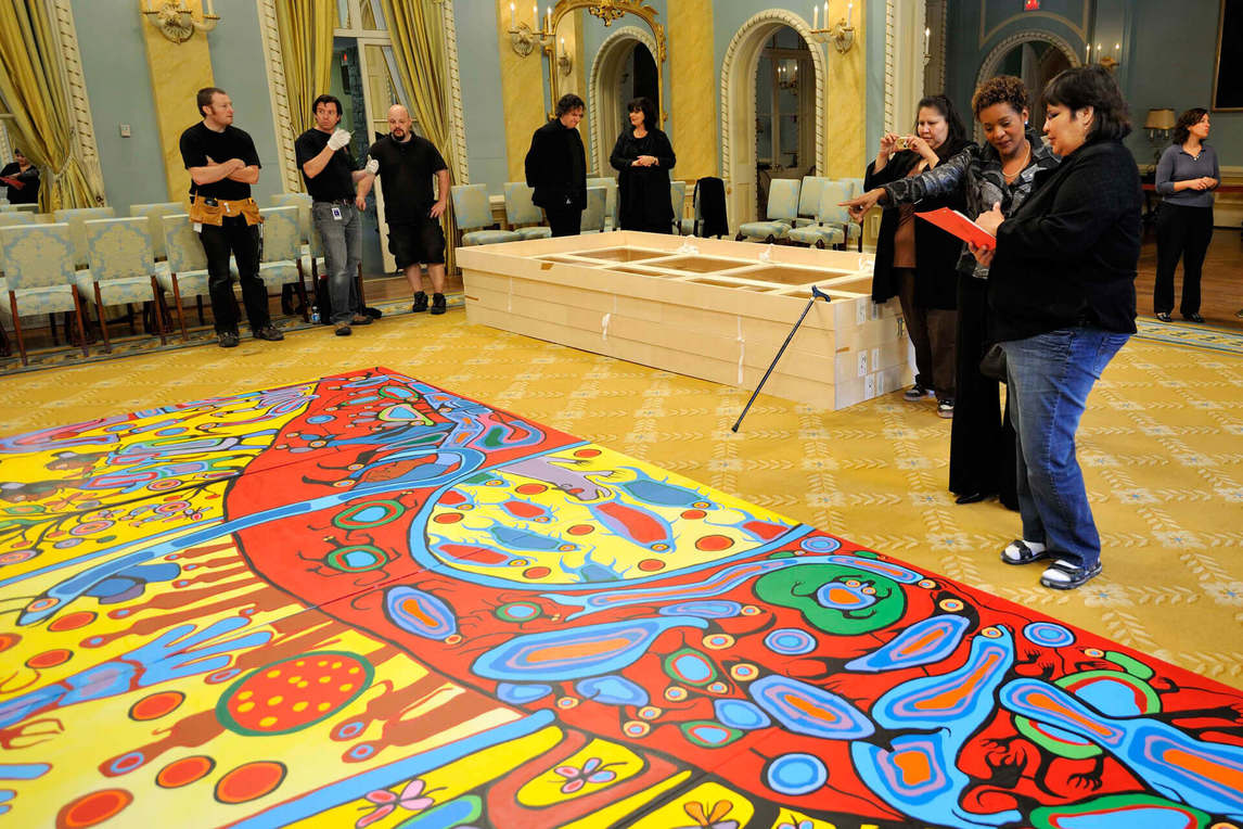 Art Canada Institute, The Right Honourable Michaëlle Jean, twenty-seventh Governor General of Canada (2005–10), flanked by Norval Morrisseau’s daughters Lisa and Victoria at the installation of Androgyny, 1983