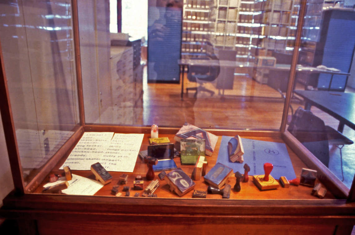 Art Canada Institute, Greg Curnoe, Installation view of rubber-stamped books and works from 1961 to 1989