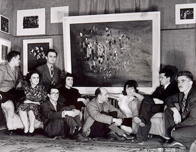 Art Canada Institute, Borduas seated beneath his iconic painting Leeward of the Island, surrounded by members of the Automatistes.