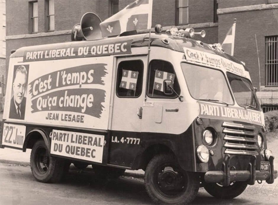 Art Canada Institute, The Liberal Party slogan “C’est l’temps qu’ça change” (It’s time things changed) on the side of a truck