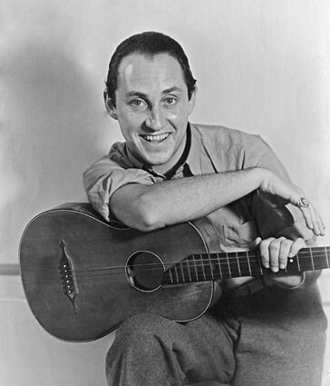 Art Canada Institute, Oscar Cahen with a guitar, c. 1945