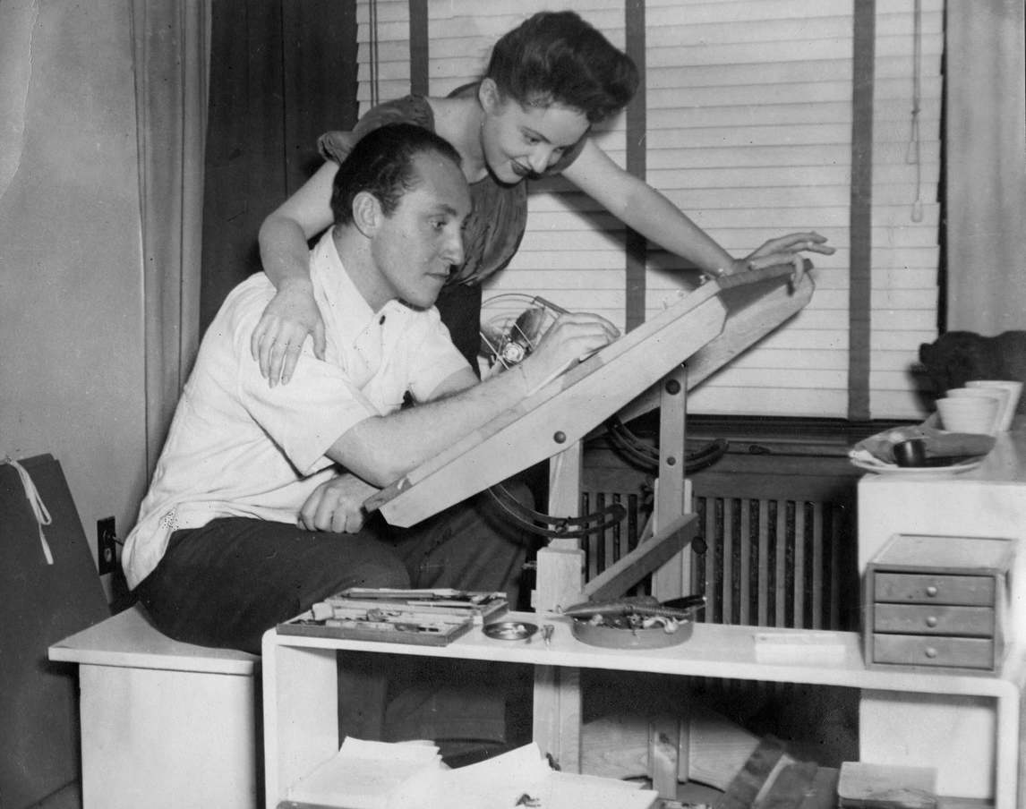 Art Canada Institute, Oscar Cahen and Mimi at the drafting table in Montreal, c. 1943