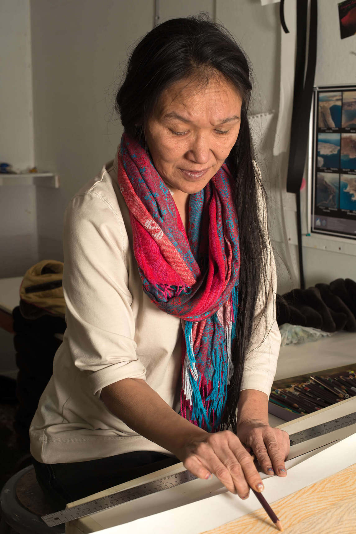 Art Canada Institute, William Ritchie, photograph of  Shuvinai Ashoona drawing in Kinngait Studios, January 29, 2013