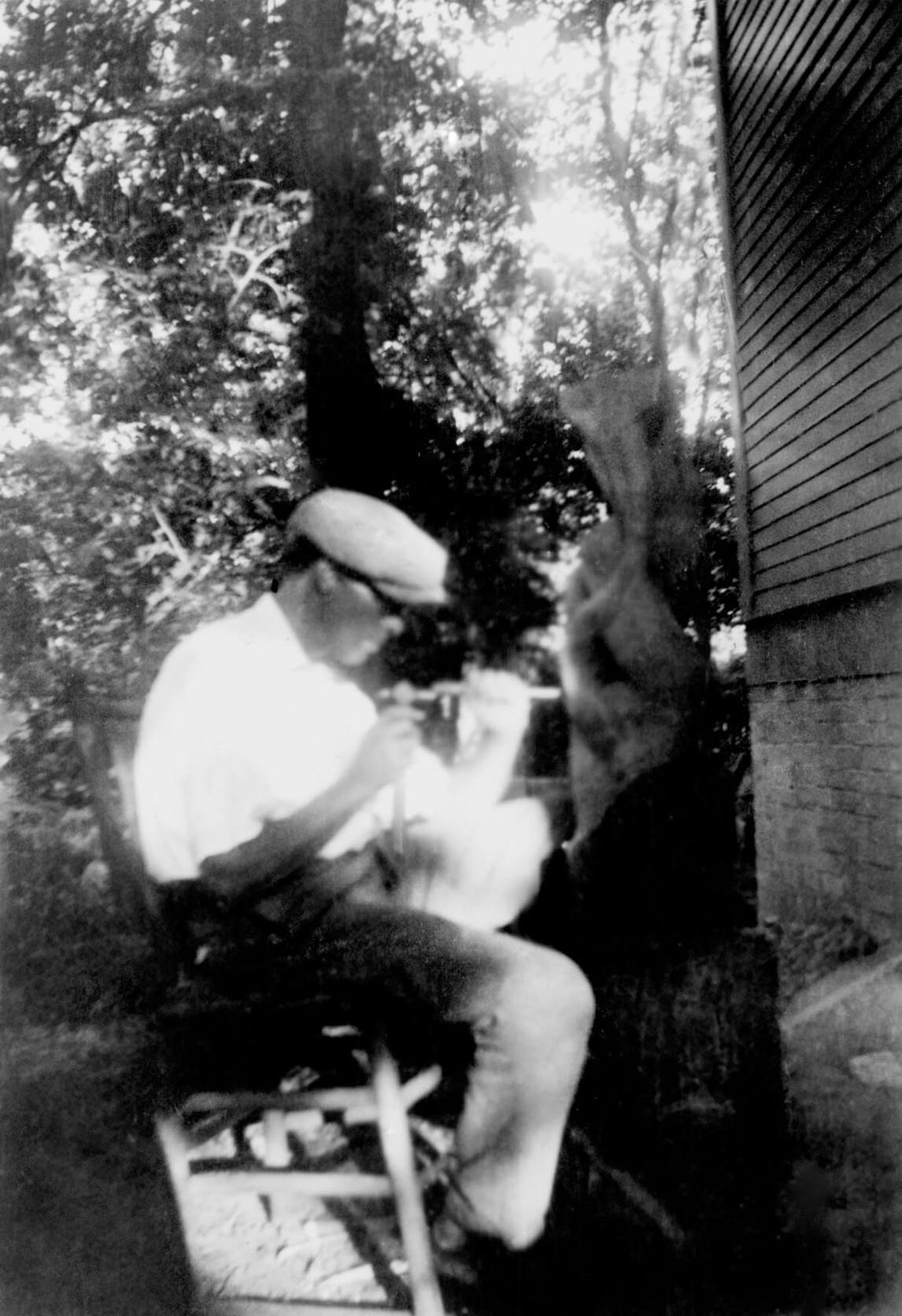 Art Canada Institute, photograph of Lionel LeMoine FitzGerald carving Untitled oak sculpture, 1936