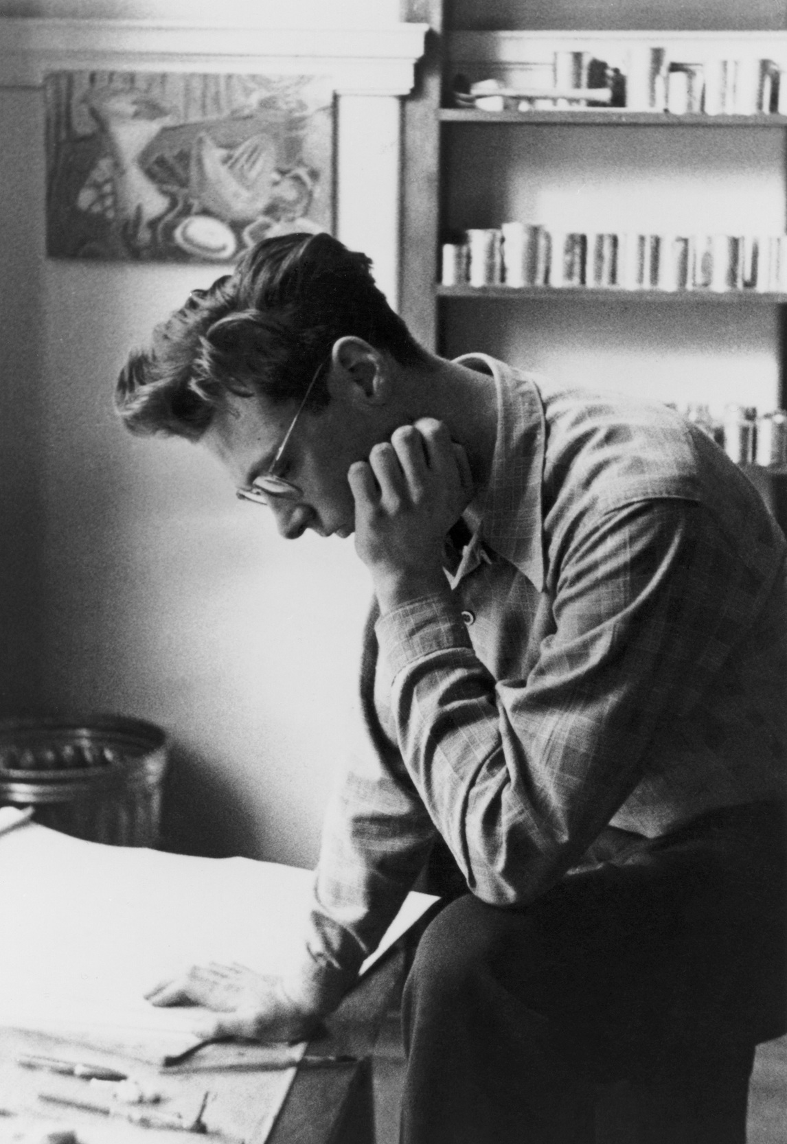 Paterson Ewen examining drawings, 1948