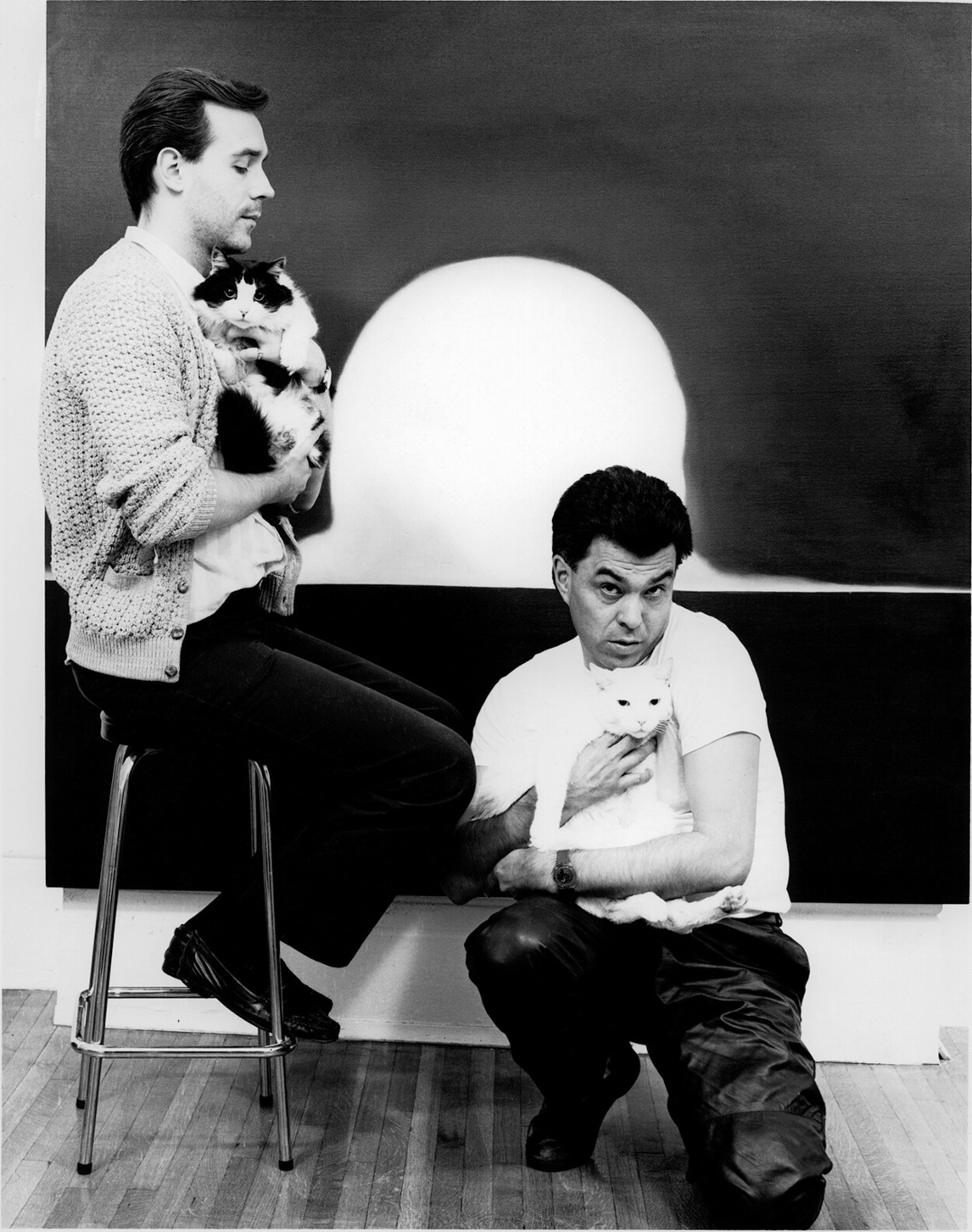 Paul Gardner and Robert Houle with their cats, Simon and Windigo