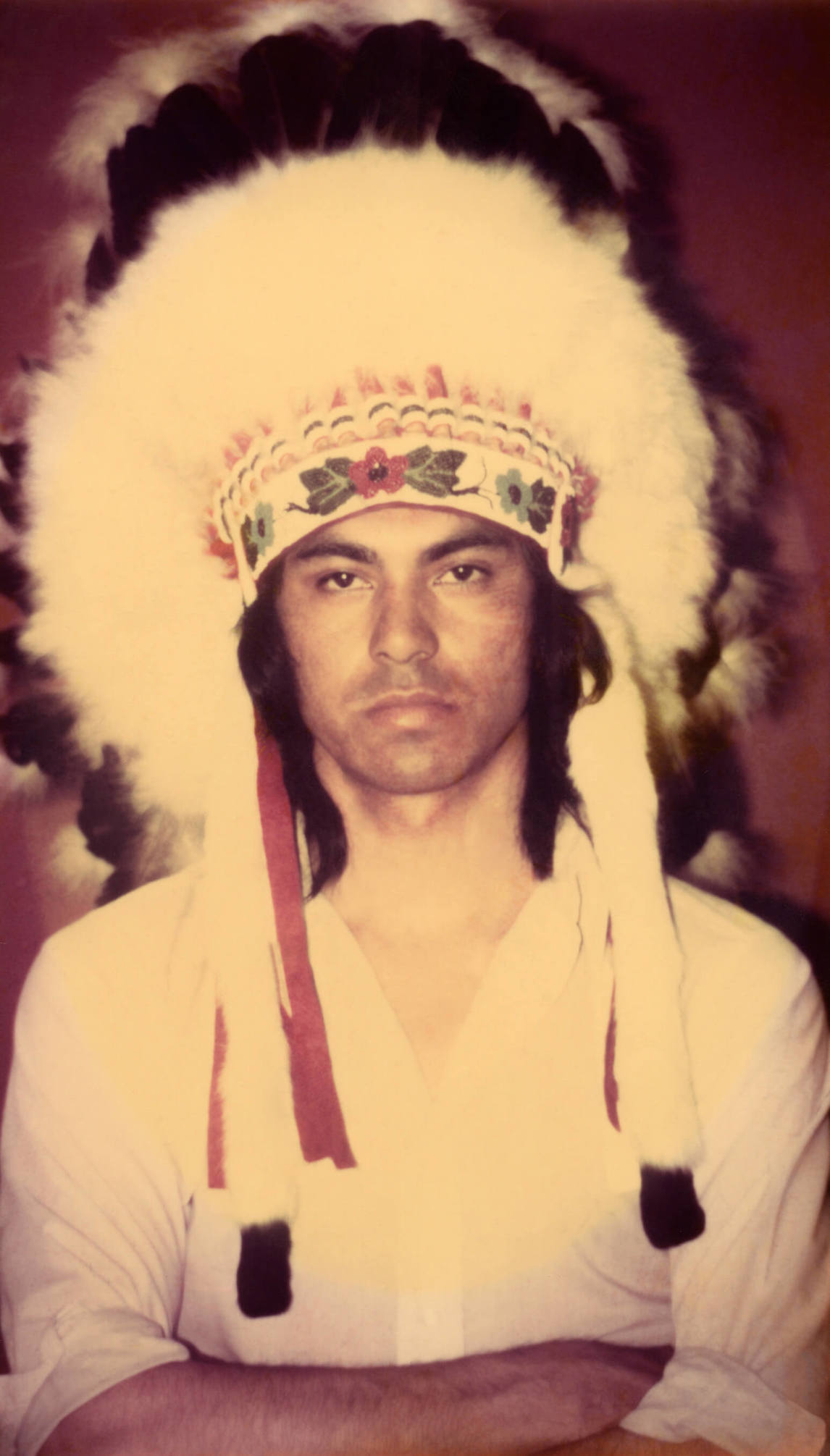  Robert Houle wearing a headdress, 1974