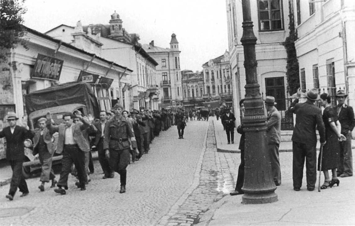 Romanian soldiers and a cadet arrest a group of Jews at 157 I.C.