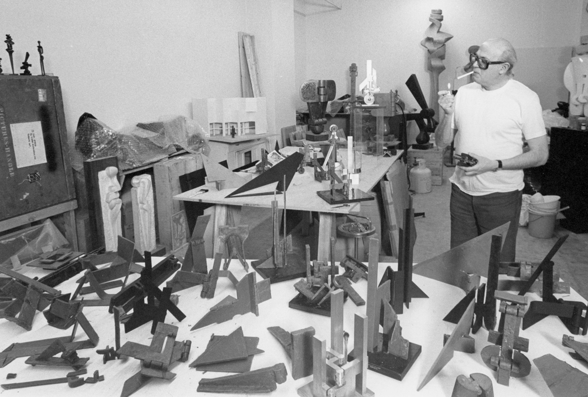 Sorel Etrog in his Yonge and Eglinton studio with studies for the Sun Life project, 1981–8