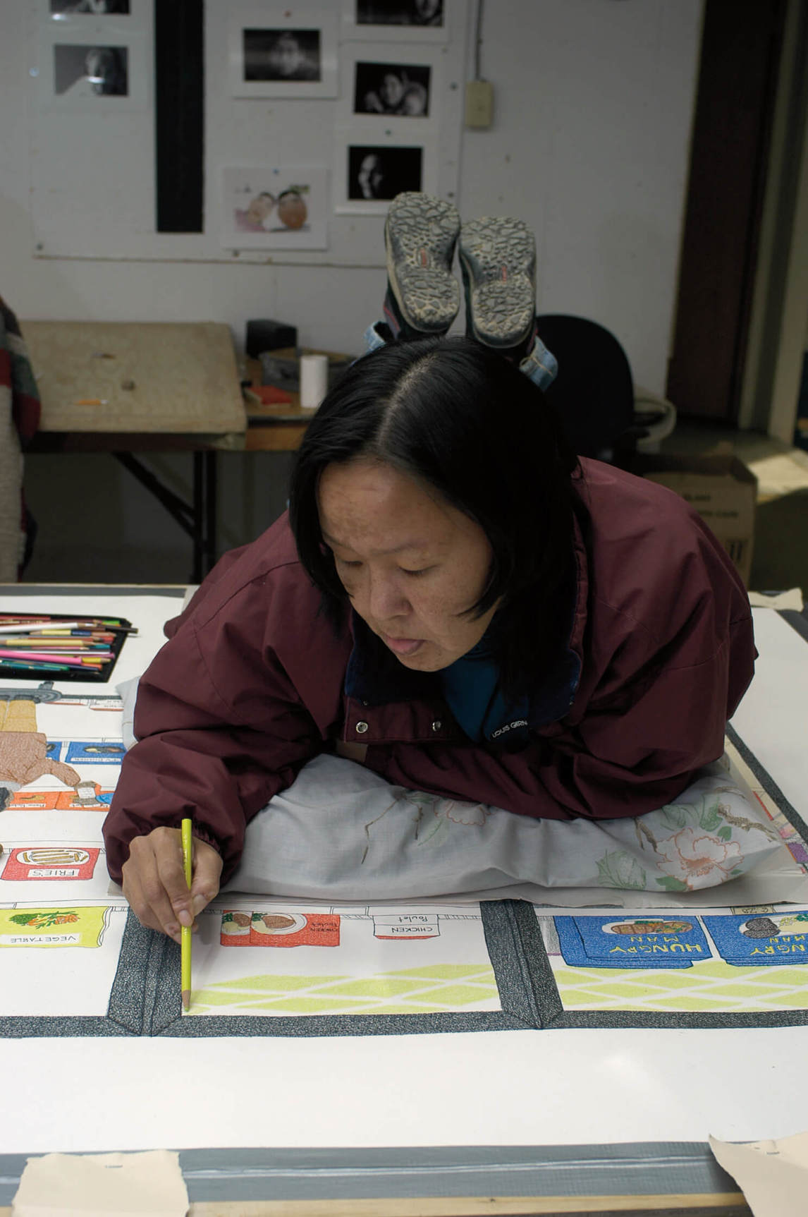 Annie Pootoogook working on Cape Dorset Freezer at Kinngait Studios