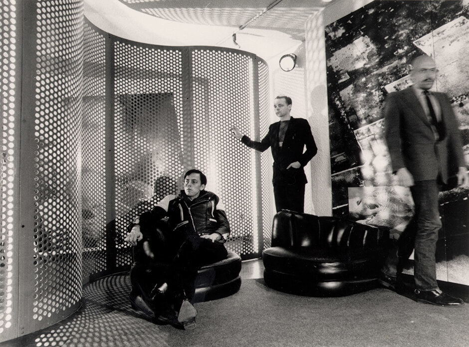 Art Canada Institute, General Idea relaxes in the installation Reconstructing Futures, 1977