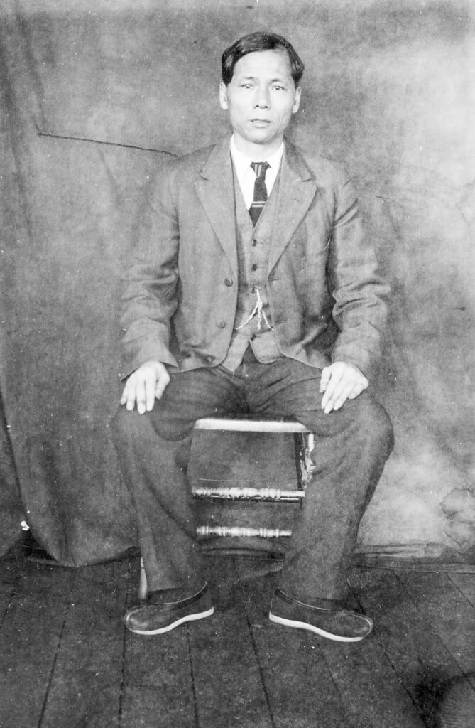 Chinese man in business suit and traditional Chinese shoes