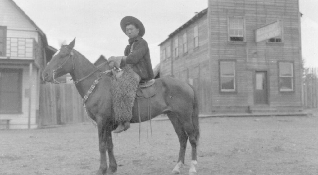 Kong Shing Sing on a horse on Barlow Avenue in Quesnel